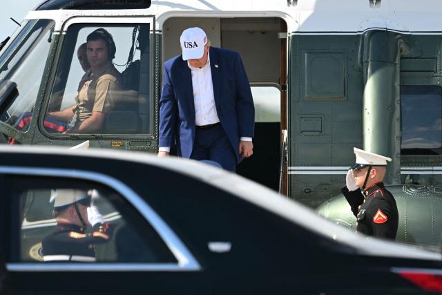 US President Donald Trump disembarks from Marine One at Joint Base Andrews, Maryland on June 21, 2026. Trump is returning to the White House from Camp David. (Photo by Kent NISHIMURA / AFP)