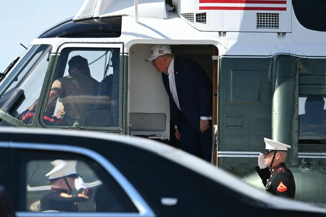 US President Donald Trump disembarks from Marine One at Joint Base Andrews, Maryland on June 21, 2026. Trump is returning to the White House from Camp David. (Photo by Kent NISHIMURA / AFP)