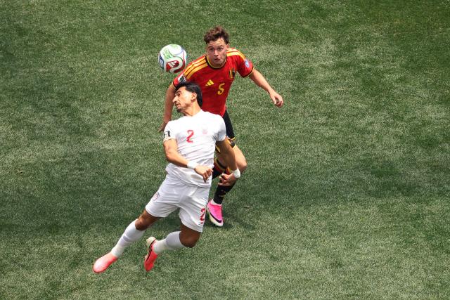 Iran's defender #02 Saleh Hardani and Belgium's defender #05 Maxim De Cuyper fight for the ball during the 2026 World Cup Group G football match between Belgium and Iran at the Los Angeles Stadium in Inglewood on June 21, 2026.  (Photo by Etienne Laurent / AFP)