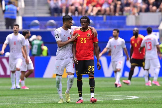 Iran's midfielder #08 Mohammad Mohebbi chats with Belgium's defender #25 Nathan Ngoy during the 2026 World Cup Group G football match between Belgium and Iran at the Los Angeles Stadium in Inglewood on June 21, 2026.  (Photo by Frederic J. Brown / AFP)