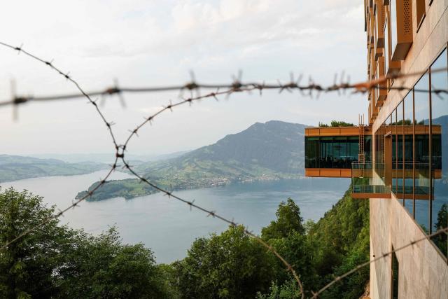 This photograph shows the delegation staff at the Burgenstock luxury hotel complex overlooking Lake Lucerne, Switzerland, on the day of talks between the U.S., Iran, Pakistan, and Qatar at the Lake Lucerne, Switzerland, on June 21, 2026, as part of high-level talks aimed at advancing a deal to end the Middle East conflict. A new round of negotiations over the Middle East war was set to kick off on June 21, 2026 with Iranian negotiators arriving in the Swiss host city hours ahead of US Vice President JD Vance, even as Tehran said it was closing the Strait of Hormuz again over Israeli attacks in Lebanon. (Photo by Nathan Howard / POOL / AFP)