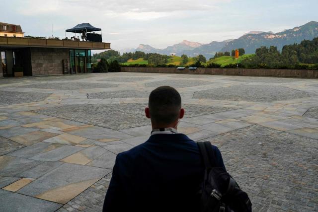 A U.S. Secret Service agent walks the grounds of the Burgenstock luxury hotel complex overlooking Lake Lucerne, Switzerland, on the day of talks between the U.S., Iran, Pakistan, and Qatar at the Lake Lucerne, Switzerland, on June 21, 2026, as part of high-level talks aimed at advancing a deal to end the Middle East conflict. A new round of negotiations over the Middle East war was set to kick off on June 21, 2026 with Iranian negotiators arriving in the Swiss host city hours ahead of US Vice President JD Vance, even as Tehran said it was closing the Strait of Hormuz again over Israeli attacks in Lebanon. (Photo by Nathan Howard / POOL / AFP)