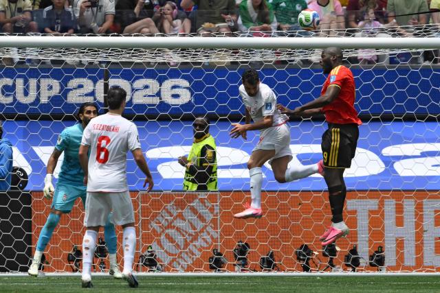 Iran's defender #04 Shojae Khalilzadeh and Belgium's forward #09 Romelu Lukaku fight for the ball during the 2026 World Cup Group G football match between Belgium and Iran at the Los Angeles Stadium in Inglewood on June 21, 2026.  (Photo by Patrick T. Fallon / AFP)