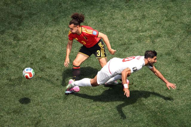 Belgium's defender #03 Arthur Theate and Iran's forward #20 Shahriyar Moghanloo fight for the ball during the 2026 World Cup Group G football match between Belgium and Iran at the Los Angeles Stadium in Inglewood on June 21, 2026.  (Photo by Etienne Laurent / AFP)