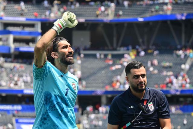Iran's goalkeeper #01 Alireza Beiranvand celebrates at the end of the 2026 World Cup Group G football match between Belgium and Iran at the Los Angeles Stadium in Inglewood on June 21, 2026.  (Photo by Frederic J. Brown / AFP)