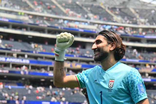 Iran's goalkeeper #01 Alireza Beiranvand celebrates at the end of the 2026 World Cup Group G football match between Belgium and Iran at the Los Angeles Stadium in Inglewood on June 21, 2026.  (Photo by Frederic J. Brown / AFP)