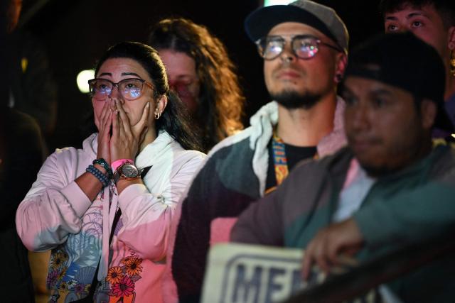 Supporters of Colombia's presidential candidate for the ruling Pacto Historico party Ivan Cepeda watch partial results displayed on a screen during the presidential runoff election at the Tequendama Hotel in Bogota on June 21, 2026. Colombians voted on June 21 in a polarized presidential runoff that could reshape the country's fragile peace process and relations with the United States, after the most violent election campaign in a decade. (Photo by Raul ARBOLEDA / AFP)