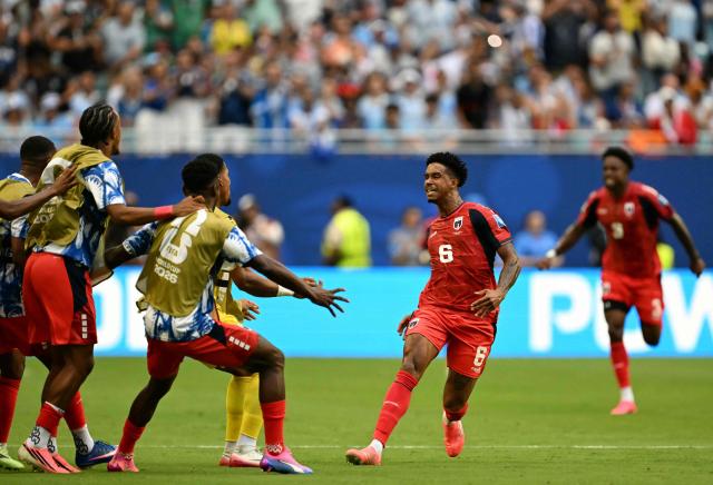 Cape Verde's midfielder #06 Kevin Pina celebrates with teammates after scoring his team's first goal during the 2026 World Cup Group H football match between Uruguay and Cape Verde at the Miami Stadium in Miami Gardens on June 21, 2026.  (Photo by CHANDAN KHANNA / AFP)