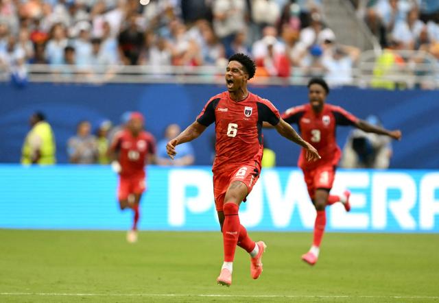 Cape Verde's midfielder #06 Kevin Pina celebrates after scoring his team's first goal during the 2026 World Cup Group H football match between Uruguay and Cape Verde at the Miami Stadium in Miami Gardens on June 21, 2026.  (Photo by CHANDAN KHANNA / AFP)