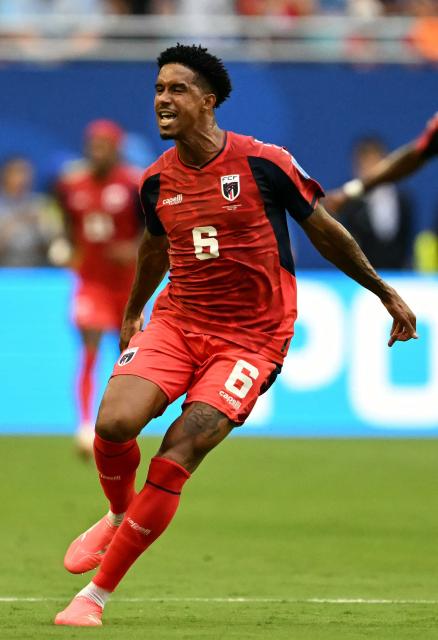 Cape Verde's midfielder #06 Kevin Pina celebrates after scoring his team's first goal during the 2026 World Cup Group H football match between Uruguay and Cape Verde at the Miami Stadium in Miami Gardens on June 21, 2026.  (Photo by CHANDAN KHANNA / AFP)
