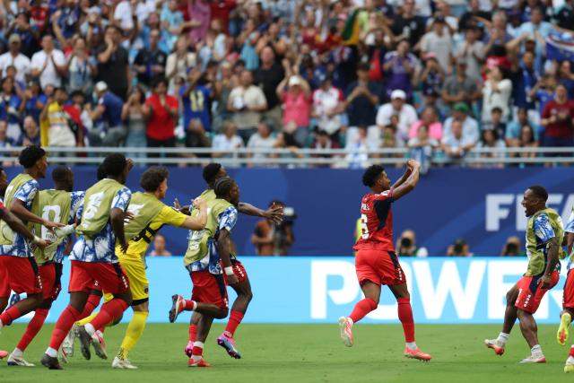 Cape Verde's midfielder #06 Kevin Pina celebrates next to teammates scoring his team's first goal during the 2026 World Cup Group H football match between Uruguay and Cape Verde at the Miami Stadium in Miami Gardens on June 21, 2026.  (Photo by PATRICIA DE MELO MOREIRA / AFP)