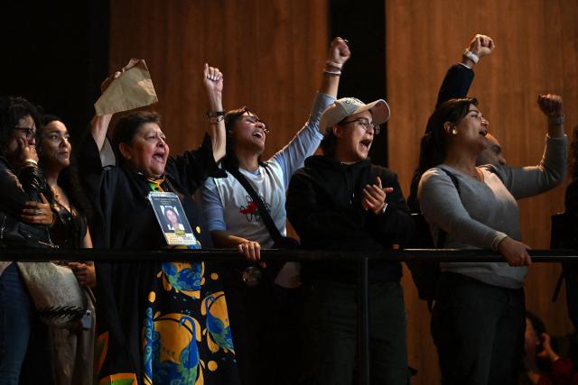 Supporters of Colombia's presidential candidate for the ruling Pacto Historico party Ivan Cepeda react as they watch partial results displayed on a screen during the presidential runoff election at the Tequendama Hotel in Bogota on June 21, 2026. Colombians voted on June 21 in a polarized presidential runoff that could reshape the country's fragile peace process and relations with the United States, after the most violent election campaign in a decade. (Photo by Raul ARBOLEDA / AFP)