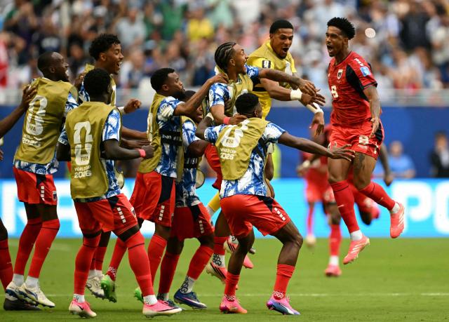 Cape Verde's midfielder #06 Kevin Pina celebrates with teammates after scoring his team's first goal during the 2026 World Cup Group H football match between Uruguay and Cape Verde at the Miami Stadium in Miami Gardens on June 21, 2026.  (Photo by CHANDAN KHANNA / AFP)