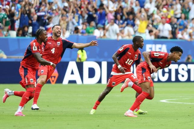 Cape Verde's midfielder #06 Kevin Pina (R) celebrates next to teammates scoring his team's first goal during the 2026 World Cup Group H football match between Uruguay and Cape Verde at the Miami Stadium in Miami Gardens on June 21, 2026.  (Photo by PATRICIA DE MELO MOREIRA / AFP)