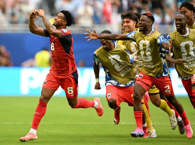Cape Verde's midfielder #06 Kevin Pina celebrates with teammates after scoring his team's first goal during the 2026 World Cup Group H football match between Uruguay and Cape Verde at the Miami Stadium in Miami Gardens on June 21, 2026.  (Photo by CHANDAN KHANNA / AFP)