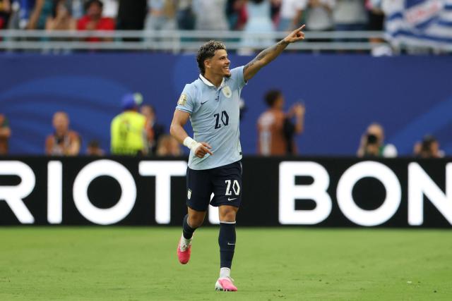 Uruguay's midfielder #20 Maximiliano Araujo celebrates scoring his team's first goal during the 2026 World Cup Group H football match between Uruguay and Cape Verde at the Miami Stadium in Miami Gardens on June 21, 2026.  (Photo by PATRICIA DE MELO MOREIRA / AFP)