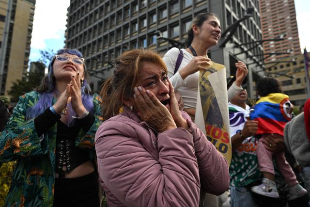 Supporters of Colombias presidential candidate for the ruling Pacto Historico party Ivan Cepeda react to the results of the presidential runoff election in Bogota, Colombia, on June 21, 2026. A flamboyant US-backed lawyer who has never held public office narrowly won Colombia's presidential runoff Sunday, swinging the country hard to the right on a promise to wage war against drug-running guerrilla groups. With more than 99 percent of polling centers reporting, Abelardo de la Espriella had 49.67 percent of the vote, an unassailable lead over his rival, left-wing Senator Ivan Cepeda who trailed at 48.69 percent, according to official results. (Photo by Luis ACOSTA / AFP)