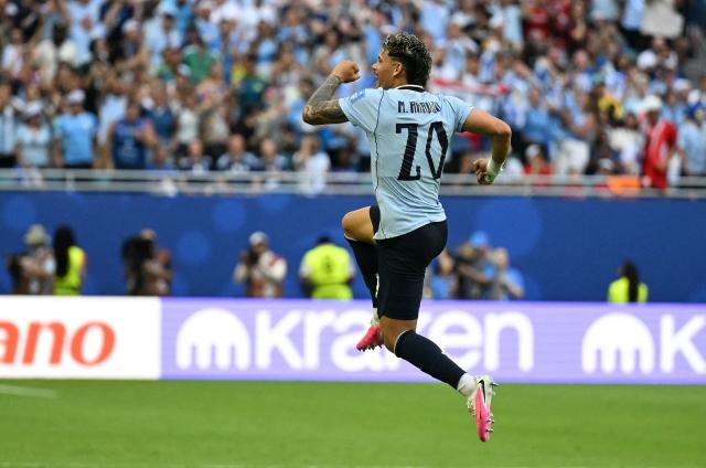 Uruguay's midfielder #20 Maximiliano Araujo celebrates scoring his team's first goal during the 2026 World Cup Group H football match between Uruguay and Cape Verde at the Miami Stadium in Miami Gardens on June 21, 2026.  (Photo by CHANDAN KHANNA / AFP)