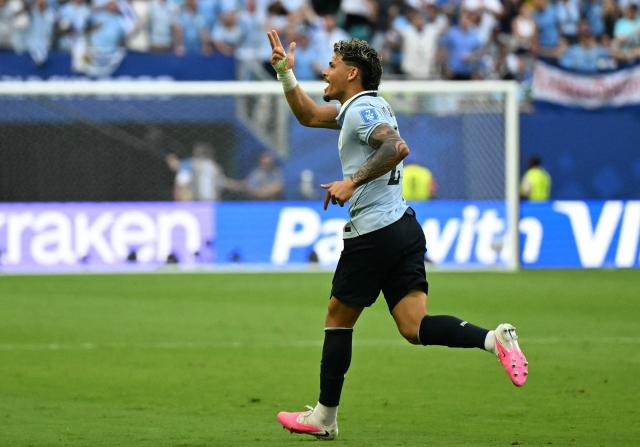 Uruguay's midfielder #20 Maximiliano Araujo celebrates scoring his team's first goal during the 2026 World Cup Group H football match between Uruguay and Cape Verde at the Miami Stadium in Miami Gardens on June 21, 2026.  (Photo by CHANDAN KHANNA / AFP)