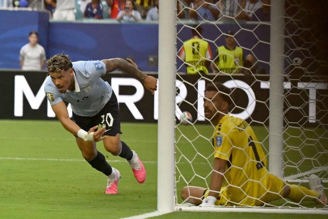 Uruguay's midfielder #20 Maximiliano Araujo celebrates scoring his team's first goal during the 2026 World Cup Group H football match between Uruguay and Cape Verde at the Miami Stadium in Miami Gardens on June 21, 2026.  (Photo by CHANDAN KHANNA / AFP)