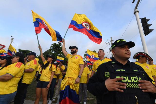 Supporters of Colombia's presidential candidate for the Defensores de la Patria movement, Abelardo de la Espriella, celebrate the results of the presidential election runoff at the Ventana al Mundo monument in Barranquilla, Colombia, on June 21, 2026. A flamboyant US-backed lawyer who has never held public office narrowly won Colombia's presidential runoff on June 21, swinging the country hard to the right on a promise to wage war against drug-running guerrilla groups. With more than 99 percent of polling centers reporting, Abelardo de la Espriella had 49.67 percent of the vote, an unassailable lead over his rival, left-wing Senator Ivan Cepeda who trailed at 48.69 percent, according to official results. (Photo by Jaime SALDARRIAGA / AFP)