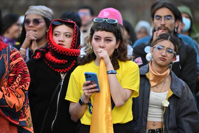 Supporters of Colombias presidential candidate for the ruling Pacto Historico party Ivan Cepeda react to the results of the presidential runoff election in Bogota, Colombia, on June 21, 2026. A flamboyant US-backed lawyer who has never held public office narrowly won Colombia's presidential runoff Sunday, swinging the country hard to the right on a promise to wage war against drug-running guerrilla groups. With more than 99 percent of polling centers reporting, Abelardo de la Espriella had 49.67 percent of the vote, an unassailable lead over his rival, left-wing Senator Ivan Cepeda who trailed at 48.69 percent, according to official results. (Photo by Luis ACOSTA / AFP)
