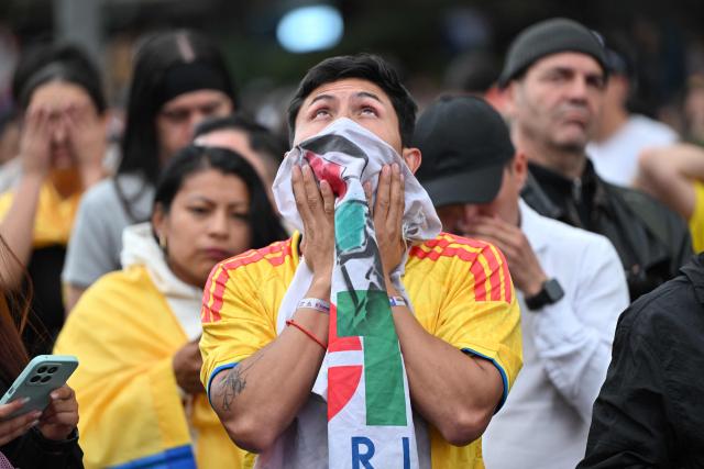 A supporter of Colombia's presidential candidate for the ruling Pacto Historico party Ivan Cepeda reacts to the results of the presidential runoff election in Bogota, Colombia, on June 21, 2026. A flamboyant US-backed lawyer who has never held public office narrowly won Colombia's presidential runoff Sunday, swinging the country hard to the right on a promise to wage war against drug-running guerrilla groups. With more than 99 percent of polling centers reporting, Abelardo de la Espriella had 49.67 percent of the vote, an unassailable lead over his rival, left-wing Senator Ivan Cepeda who trailed at 48.69 percent, according to official results. (Photo by Luis ACOSTA / AFP)