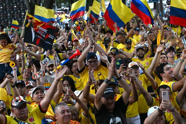 Supporters of Colombia's presidential candidate for the Defensores de la Patria movement Abelardo de la Espriella celebrate the results of the presidential runoff election in Cali, Colombia, on June 21, 2026. A flamboyant US-backed lawyer who has never held public office narrowly won Colombia's presidential runoff Sunday, swinging the country hard to the right on a promise to wage war against drug-running guerrilla groups. With more than 99 percent of polling centers reporting, Abelardo de la Espriella had 49.65 percent of the vote, an unassailable lead over his rival, left-wing Senator Ivan Cepeda who trailed at 48.70 percent, according to official results. (Photo by Joaquin SARMIENTO / AFP)