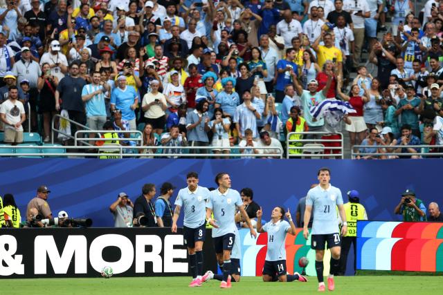 Uruguay's forward #14 Agustin Canobbio celebrates scoring his team's second goal next to teammates midfielder #08 Federico Valverde, midfielder #05 Manuel Ugarte and forward #21 Federico Vinas during the 2026 World Cup Group H football match between Uruguay and Cape Verde at the Miami Stadium in Miami Gardens on June 21, 2026.  (Photo by PATRICIA DE MELO MOREIRA / AFP)