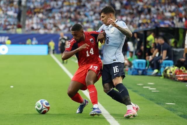 Cape Verde's midfielder #14 Deroy Duarte and Uruguay's defender #16 Mathias Olivera fight for the ball during the 2026 World Cup Group H football match between Uruguay and Cape Verde at the Miami Stadium in Miami Gardens on June 21, 2026.  (Photo by PATRICIA DE MELO MOREIRA / AFP)
