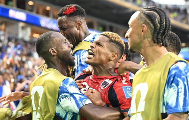Cape Verde's forward #26 Helio Varela (C) celebrates with teammates after scoring his team's second goal during the 2026 World Cup Group H football match between Uruguay and Cape Verde at the Miami Stadium in Miami Gardens on June 21, 2026.  (Photo by CHANDAN KHANNA / AFP)