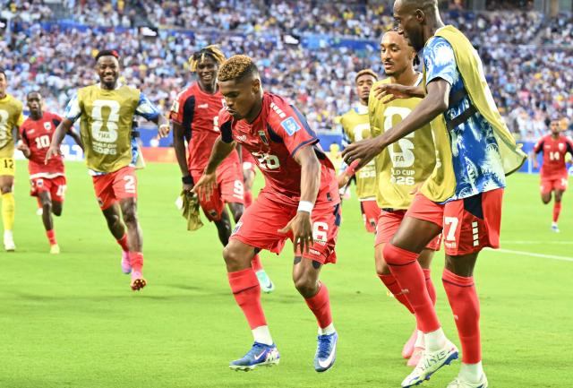 Cape Verde's forward #26 Helio Varela (C) celebrates with teammates after scoring his team's second goal during the 2026 World Cup Group H football match between Uruguay and Cape Verde at the Miami Stadium in Miami Gardens on June 21, 2026.  (Photo by CHANDAN KHANNA / AFP)