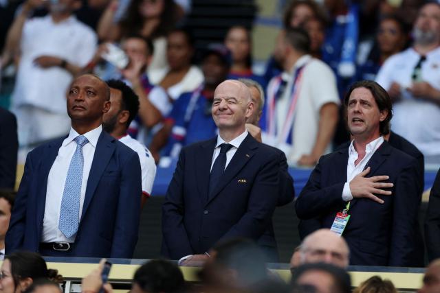 President of the Confederation of African Football Patrice Motsepe, FIFA President Gianni Infantino and the Ppresident of the Uruguayan Football Association Ignacio Alonso are seen ahead of the 2026 World Cup Group H football match between Uruguay and Cape Verde at the Miami Stadium in Miami Gardens on June 21, 2026.  (Photo by PATRICIA DE MELO MOREIRA / AFP)