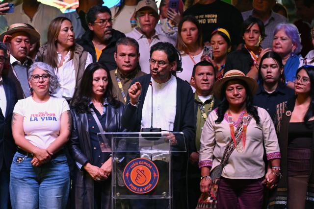 Colombia's presidential candidate for the ruling Pacto Historico party, Ivan Cepeda (C), speaks next to running mate Aida Quilcue (2nd R) after the first results of the presidential election runoff at the Tequendama Hotel in Bogota on June 21, 2026. A flamboyant US-backed lawyer who has never held public office narrowly won Colombia's presidential runoff on June 21, swinging the country hard to the right on a promise to wage war against drug-running guerrilla groups. With more than 99 percent of polling centers reporting, Abelardo de la Espriella had 49.67 percent of the vote, an unassailable lead over his rival, left-wing Senator Ivan Cepeda who trailed at 48.69 percent, according to official results. (Photo by Raul ARBOLEDA / AFP)
