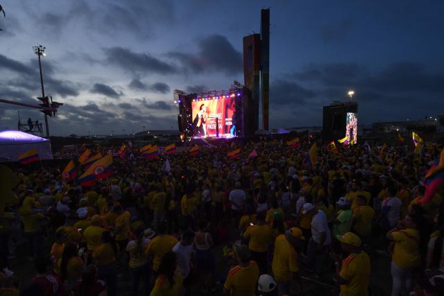 Supporters of Colombia's presidential candidate for the Defensores de la Patria movement Abelardo de la Espriella celebrate the results of the presidential runoff election at the Ventana al Mundo monument in Barranquilla, Colombia, on June 21, 2026. A flamboyant US-backed lawyer who has never held public office narrowly won Colombia's presidential runoff on June 21, swinging the country hard to the right on a promise to wage war against drug-running guerrilla groups. With more than 99 percent of polling centers reporting, Abelardo de la Espriella had 49.67 percent of the vote, an unassailable lead over his rival, left-wing Senator Ivan Cepeda who trailed at 48.69 percent, according to official results. (Photo by Jaime SALDARRIAGA / AFP)