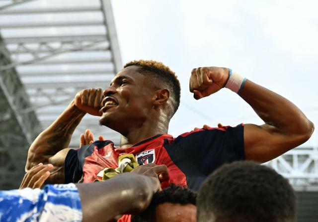 Cape Verde's forward #26 Helio Varela celebrates with teammates after scoring his team's second goal during the 2026 World Cup Group H football match between Uruguay and Cape Verde at the Miami Stadium in Miami Gardens on June 21, 2026.  (Photo by CHANDAN KHANNA / AFP)