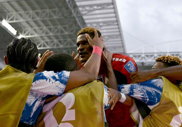 Cape Verde's forward #26 Helio Varela celebrates with teammates after scoring his team's second goal during the 2026 World Cup Group H football match between Uruguay and Cape Verde at the Miami Stadium in Miami Gardens on June 21, 2026.  (Photo by CHANDAN KHANNA / AFP)