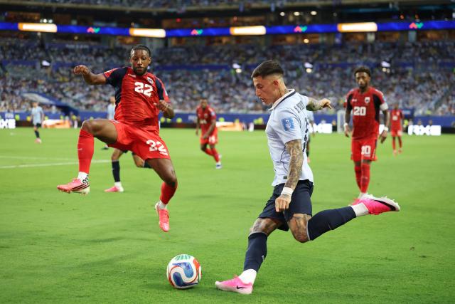 Cape Verde's defender #22 Steven Moreira and Uruguay's midfielder #18 Brian Rodriguez fight for the ball during the 2026 World Cup Group H football match between Uruguay and Cape Verde at the Miami Stadium in Miami Gardens on June 21, 2026.  (Photo by PATRICIA DE MELO MOREIRA / AFP)