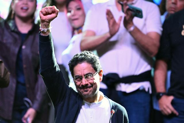 Colombia's presidential candidate for the ruling Pacto Historico party, Ivan Cepeda, raises his fist after the first results of the presidential election runoff at the Tequendama Hotel in Bogota on June 21, 2026. A flamboyant US-backed lawyer who has never held public office narrowly won Colombia's presidential runoff on June 21, swinging the country hard to the right on a promise to wage war against drug-running guerrilla groups. With more than 99 percent of polling centers reporting, Abelardo de la Espriella had 49.67 percent of the vote, an unassailable lead over his rival, left-wing Senator Ivan Cepeda who trailed at 48.69 percent, according to official results. (Photo by Raul ARBOLEDA / AFP)