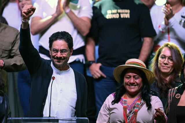 Colombia's presidential candidate for the ruling Pacto Historico party, Ivan Cepeda, raises his fist next to running mate Aida Quilcue (R) after the first results of the presidential election runoff at the Tequendama Hotel in Bogota on June 21, 2026. A flamboyant US-backed lawyer who has never held public office narrowly won Colombia's presidential runoff on June 21, swinging the country hard to the right on a promise to wage war against drug-running guerrilla groups. With more than 99 percent of polling centers reporting, Abelardo de la Espriella had 49.67 percent of the vote, an unassailable lead over his rival, left-wing Senator Ivan Cepeda who trailed at 48.69 percent, according to official results. (Photo by Raul ARBOLEDA / AFP)