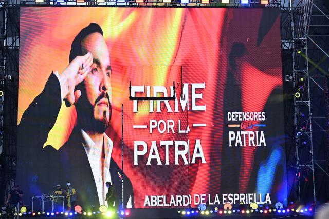 Supporters of presidential candidate Abelardo de la Espriella of the Defensores de la Patria movement watch a giant screen showing a portrait of the candidate and the slogan “Firm for the fatherland” following the runoff election in Barranquilla, Colombia, on June 21, 2026. A flamboyant US-backed lawyer who has never held public office narrowly won Colombia's presidential runoff on June 21, swinging the country hard to the right on a promise to wage war against drug-running guerrilla groups. With more than 99 percent of polling centers reporting, Abelardo de la Espriella had 49.67 percent of the vote, an unassailable lead over his rival, left-wing Senator Ivan Cepeda who trailed at 48.69 percent, according to official results. (Photo by Juan BARRETO / AFP)