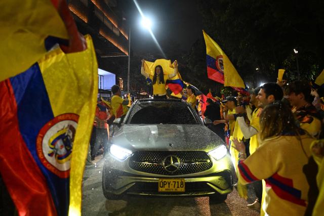 Supporters of Colombia's presidential candidate for the Defensores de la Patria movement, Abelardo de la Espriella, celebrate the results of the presidential runoff election in Bogota on June 21, 2026. A flamboyant US-backed lawyer who has never held public office narrowly won Colombia's presidential runoff on June 21, swinging the country hard to the right on a promise to wage war against drug-running guerrilla groups. With more than 99 percent of polling centers reporting, Abelardo de la Espriella had 49.67 percent of the vote, an unassailable lead over his rival, left-wing Senator Ivan Cepeda who trailed at 48.69 percent, according to official results. (Photo by Luis ACOSTA / AFP)