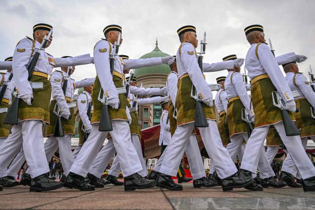 Malaysian honour guards march before a welcome ceremony for Bangladesh's Prime Minister Tarique Rahman at the Federal Government office "Putra Perdana" in Putrajaya on June 22, 2026. (Photo by MOHD RASFAN / AFP)