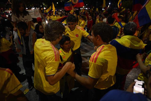 Supporter of Colombia's presidential candidate for the Defensores de la Patria movement, Abelardo de la Espriella, celebrate the results of the presidential runoff election in Bogota on June 21, 2026. A flamboyant US-backed lawyer who has never held public office narrowly won Colombia's presidential runoff on June 21, swinging the country hard to the right on a promise to wage war against drug-running guerrilla groups. With more than 99 percent of polling centers reporting, Abelardo de la Espriella had 49.67 percent of the vote, an unassailable lead over his rival, left-wing Senator Ivan Cepeda who trailed at 48.69 percent, according to official results. (Photo by Luis ACOSTA / AFP)