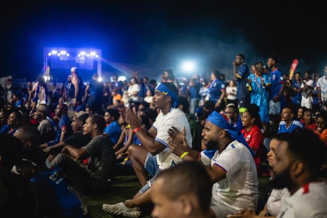 Cape Verde fans react as they gather to watch their team play against Uruguay during their FIFA World Cup match in Porto Novo on June 21, 2026. (Photo by Queila Fernandes / AFP)