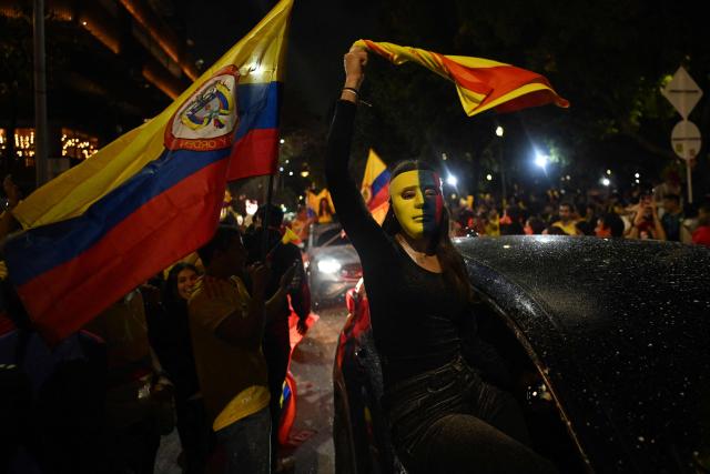 Supporter of Colombia's presidential candidate for the Defensores de la Patria movement, Abelardo de la Espriella, celebrate the results of the presidential runoff election in Bogota on June 21, 2026. A flamboyant US-backed lawyer who has never held public office narrowly won Colombia's presidential runoff on June 21, swinging the country hard to the right on a promise to wage war against drug-running guerrilla groups. With more than 99 percent of polling centers reporting, Abelardo de la Espriella had 49.67 percent of the vote, an unassailable lead over his rival, left-wing Senator Ivan Cepeda who trailed at 48.69 percent, according to official results. (Photo by Luis ACOSTA / AFP)