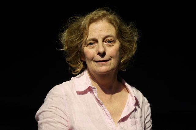(FILES) French stage director Claire Lasne Darcueil poses at the 'MC93' Maison de la Culture de Seine-Saint-Denis in Bobigny, north-eastern suburb of Paris, on June 11, 2026. At the MC93 national theatre, around fifty children and adults will be performing together with great enthusiasm from June 24, 2026 onwards: Claire Lasne Darcueil has brought together dozens of amateur actors to create "Chez Samy", a fable about a café that has disappeared and an ode to collective joy. (Photo by Ludovic MARIN / AFP)
