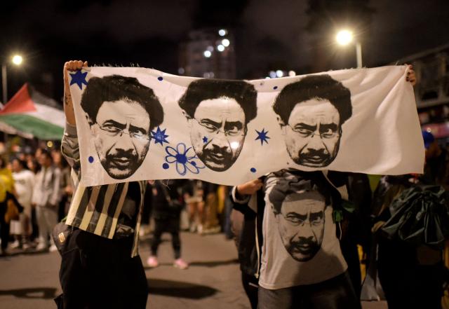 Supporters of Colombia's presidential candidate Ivan Cepeda of the ruling Pacto Historico party gather following the preliminary results of the presidential runoff election in Bogota on June 21, 2026. A flamboyant US-backed lawyer who has never held public office narrowly won Colombia's presidential runoff on June 21, swinging the country hard to the right on a promise to wage war against drug-running guerrilla groups. With more than 99 percent of polling centers reporting, Abelardo de la Espriella had 49.67 percent of the vote, an unassailable lead over his rival, left-wing Senator Ivan Cepeda who trailed at 48.69 percent, according to official results. (Photo by Sebastian BARROS / AFP)