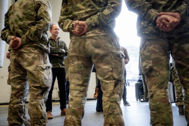 Danish Defence Minister Jeppe Bruus (Social Democrats) stands with military personnel after landing in Kangerlussuaq, Greenland, on the evening of June 21, 2026. Bad weather prevented his planned landing in Nuuk, forcing a diversion to Kangerlussuaq. (Photo by Mads Claus Rasmussen / Ritzau Scanpix / AFP) / Denmark OUT