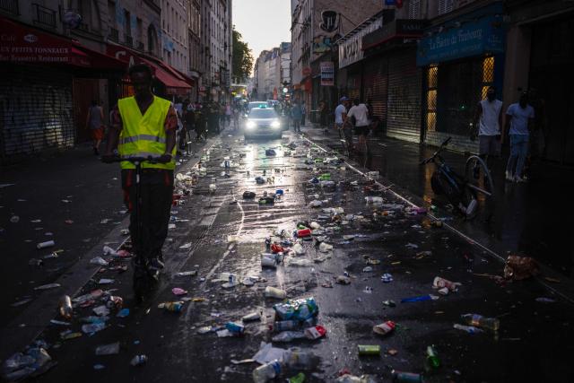 This photograph shows food and drink waste on a street on the morning following the national annual street music festival 'Fete de la Musique' in Paris on June 22, 2026. (Photo by DIMITAR DILKOFF / AFP)